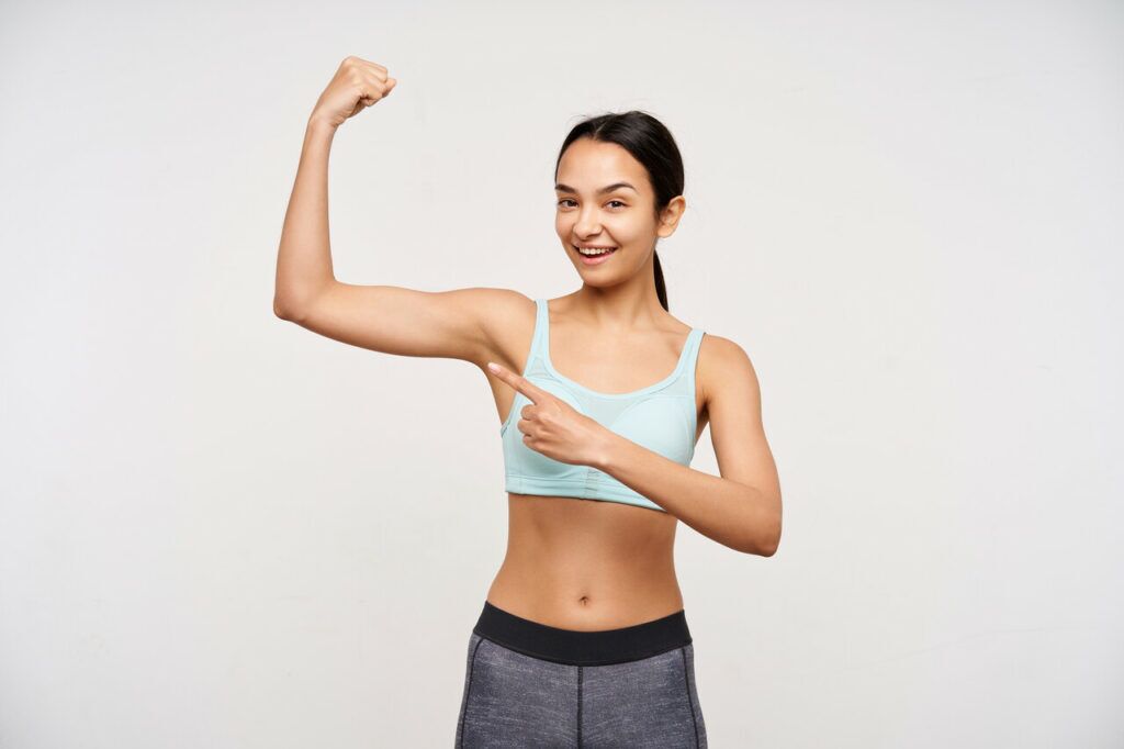 a woman showing her arm muscle